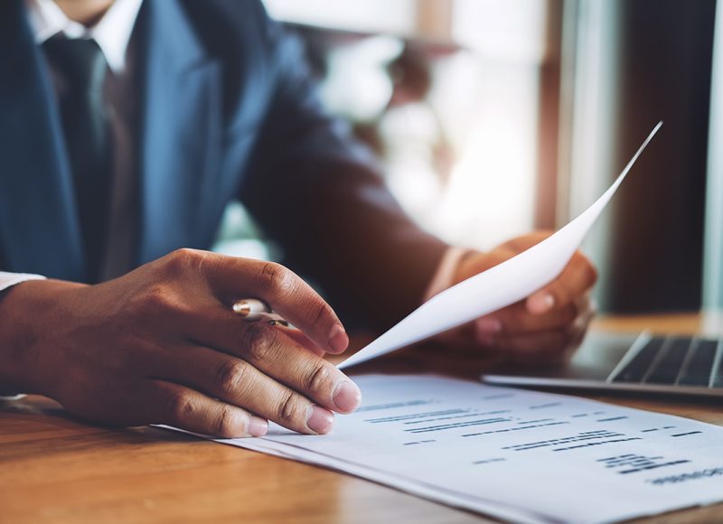 hr audit resume applicant paper and interview with using pen and computer laptop for selection human resource to company.